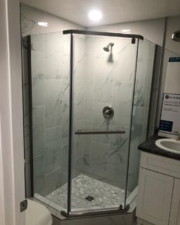 Unique corner door design, brushed nickel.
#neoangleshower #heavyglass